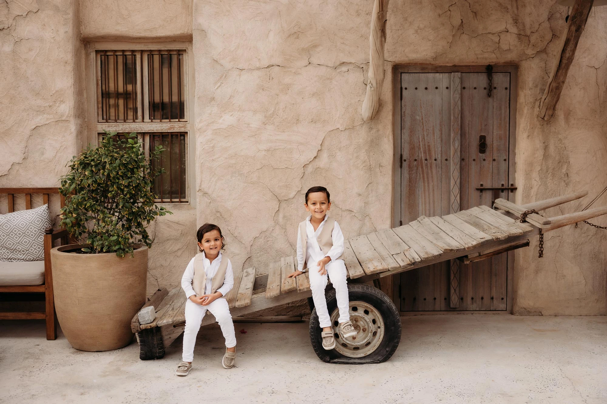 Dubai Family Photographer Al Seef Kids Sitting Rustic Alleyways