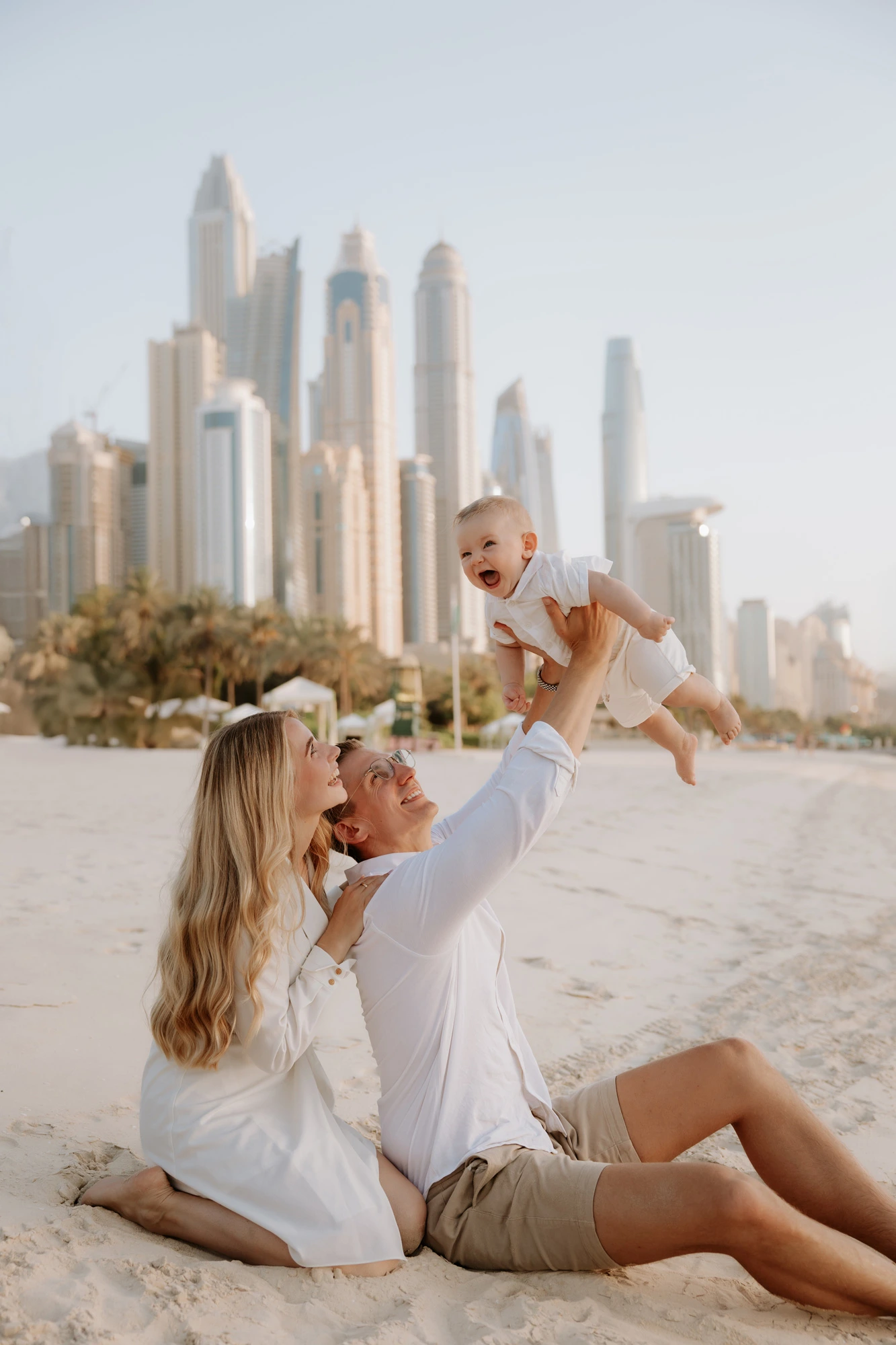 Dubai Family Photographer Beach Toddler Running Dubai Skyline Frame